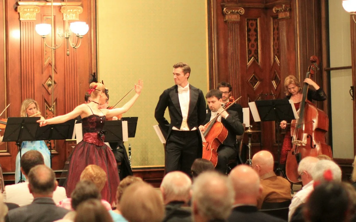 Singers and musicians on stage at a Palais Eschenbach concert