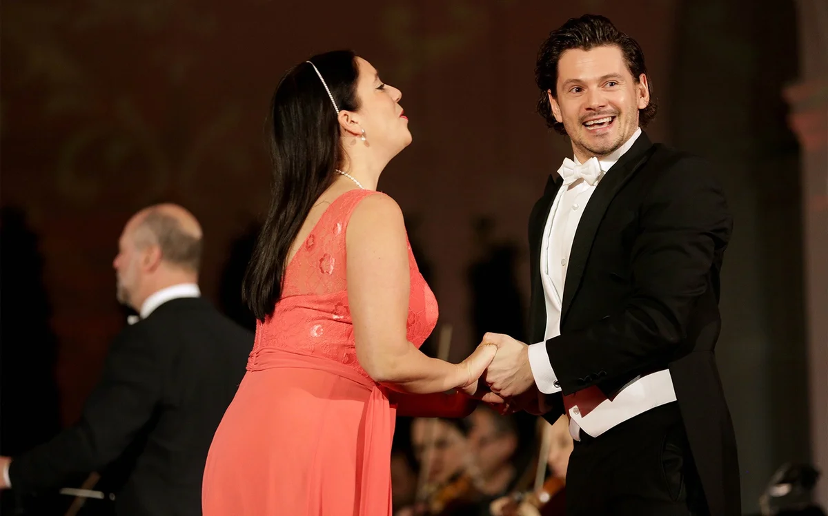 Singers and musicians performing together at a Schönbrunn concert